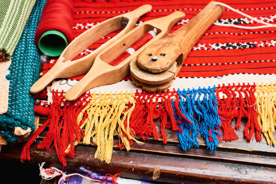 The set of working tools for weaving lying on textiles handmade