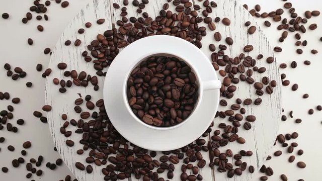 Morning coffee. Coffee magic. Roasted coffee beans turn into fragrant drink.