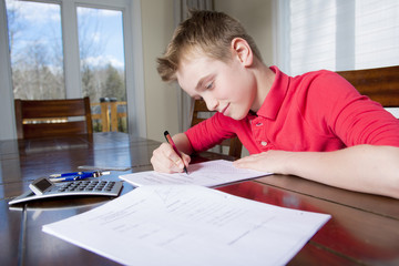 boy doing his homework at home