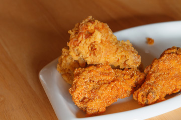 Fresh fried chicken on a white plate