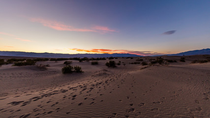 Incredible show of color and light. Sunset over the Sand dunes. Bright solar evening in scenic part of dunes. Mesquite Flat Sand Dunes, Death Valley National Park, California