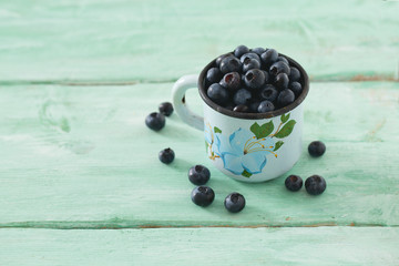 blueberry on wooden surface