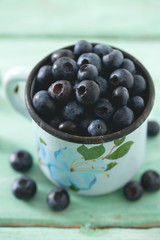 blueberry on wooden surface