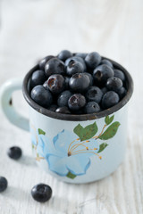 blueberry on wooden surface