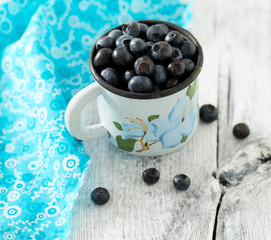 blueberry on wooden surface