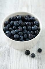 blueberry on wooden surface