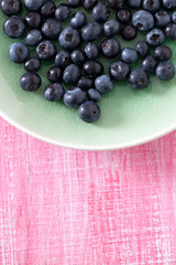 blueberry on wooden surface