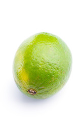 Whole fresh lime on on white, DOF