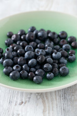 blueberry on wooden surface