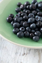 blueberry on wooden surface
