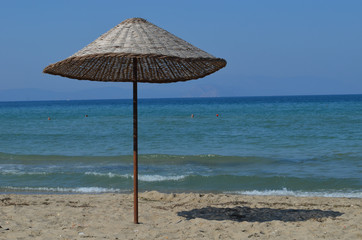 Colourful parasols on the beach at the Turkish Riviera close to Kusadasi