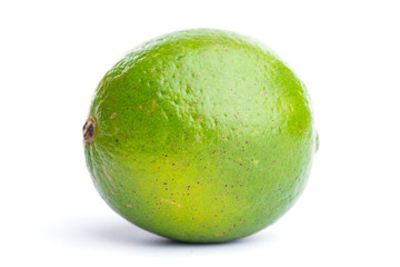 Whole fresh lime on on white, DOF