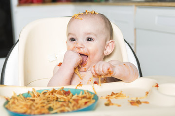 Little b eating her dinner and making a mess