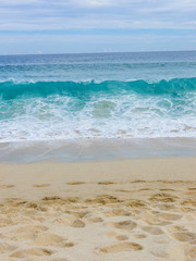 View of Waves at Sandy Beach of Cabo San Lucas in Mexico