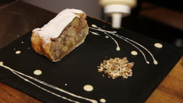 chef decorate strudel with apples