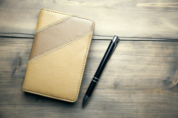 notebook and pen on table