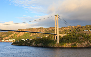 Sotra Bridge. Sotra bridge is a suspension bridge crossing Knarreviksundet in Norway connecting Fjell and Bergen. The city of Bergen can be seen in the background.