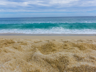 Fototapeta na wymiar View of Waves at Sandy Beach of Cabo San Lucas in Mexico