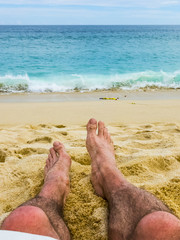 Couples Feet in the Sand Together at Beach