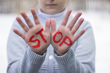 Gestures and the words stop, stop sign