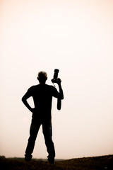 silhouette photographer at sunrise
