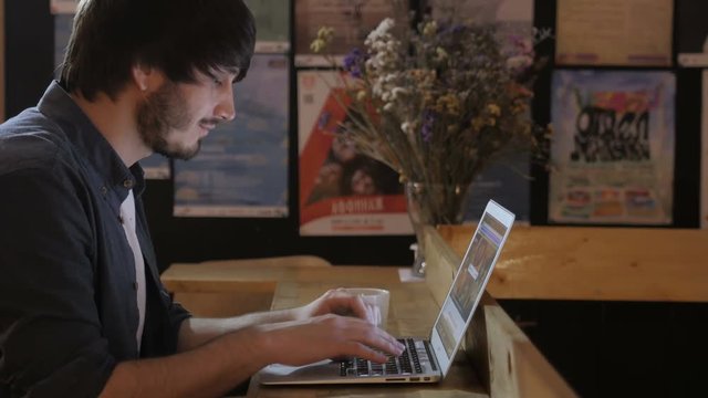 Young Entrepreneur Freelancer Working using a Laptop and in Coworking