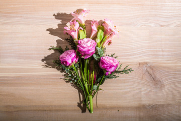 beautiful spring flowers on wooden background