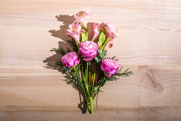 beautiful spring flowers on wooden background