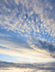 Fototapeta na wymiar Calm sunset clouds and blue sky