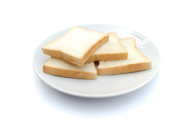 Slice of bread on dish with white background