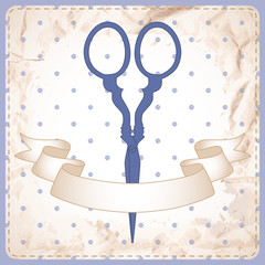 Card with old scissors and ribbon on polka dot background.