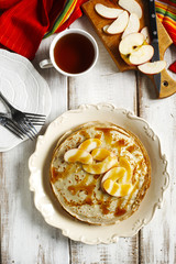 Crepes with apple and caramel sauce