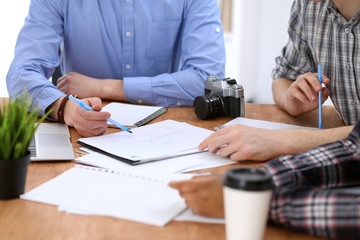 Close up of business people meeting around table. Start up team