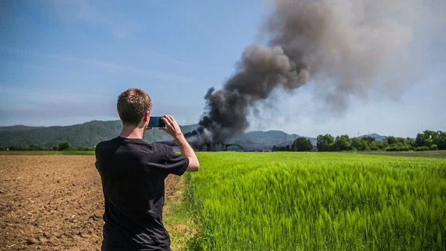 Eyewitness take a photo of fire disaster