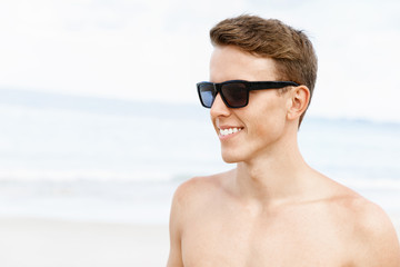 Handsome man posing at beach