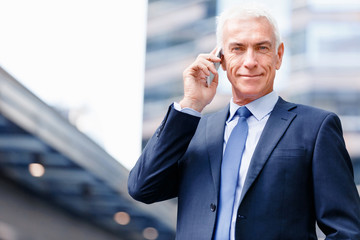 Portrait of confident businessman outdoors