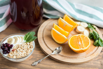 Healthy and wholesome breakfast. Sliced ​​oranges on wooden