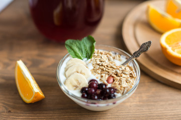 Healthy and wholesome breakfast. Yogur with muesli and currants