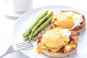 eggs benedict,on the white dish,isolated background