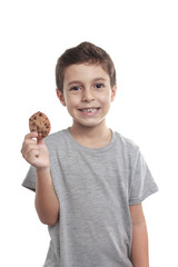 Little boy eating chocolate chip cookie