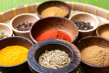 mix asian herbs in the wood bowl  on the bamboo basket