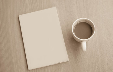 hot coffee in white cup and note pad