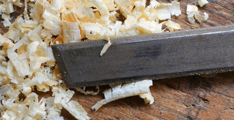 Blade of a chisel and sawdust in the Carpenter's Workbench