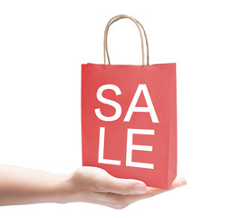 hand holding sale shopping bag on white background