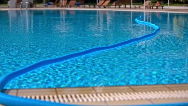 Long tube float above swimming pool