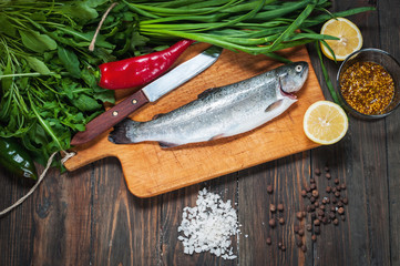 fresh fish ready to be cook on a wooden table