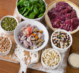 Foods high in Iron, including nuts, spinach, beans, seafood, liv