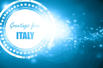 Blue stamp on a glittering background: Greetings from italy