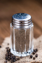 Pepper Shaker on wooden background