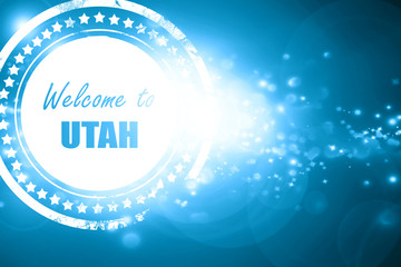 Blue stamp on a glittering background: Welcome to utah